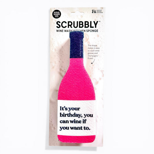 Pink bottle-shaped scrubber with text in packaging on a white background birthday