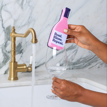 Rose Rinse Repeat Pink Kitchen Sponge washing a wine glass