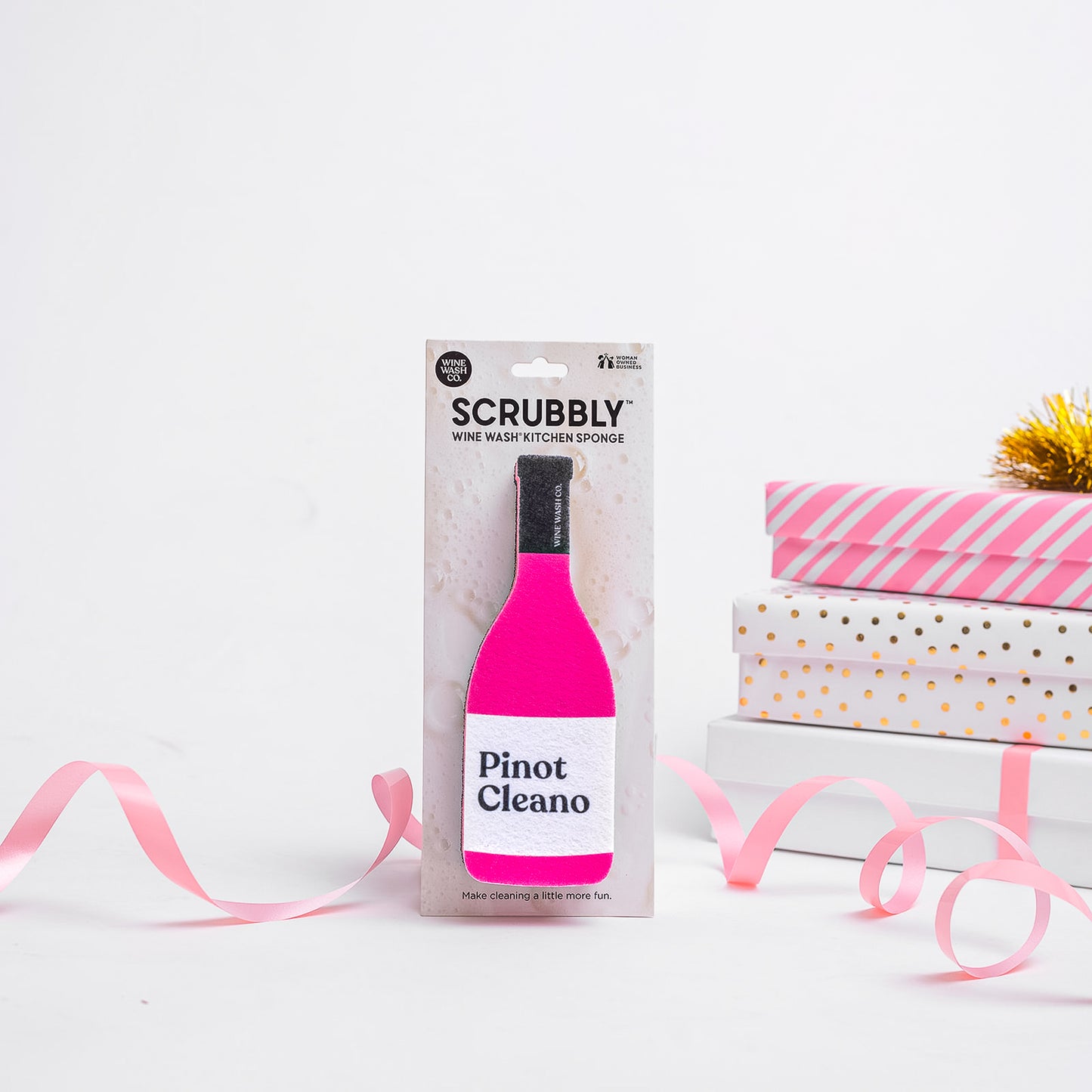 Packaged Scrubbly wine bottle-shaped kitchen sponge with 'Pinot Cleano' text on a white background.