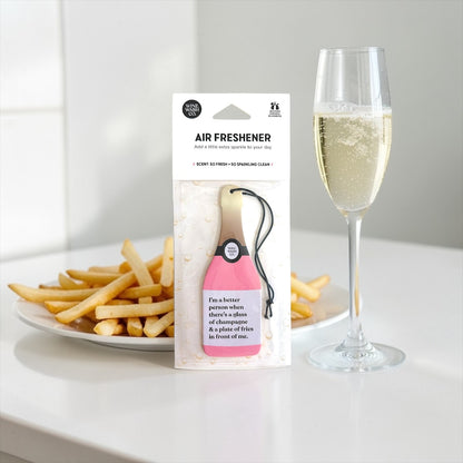 wine shaped air freshener with plate of french fries and pink champagne